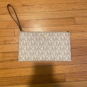 Michael Kors Wristlet /cream and brown color